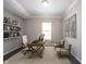 Cozy home office featuring built-in bookshelves, a large desk, and comfortable seating at 1590 Birchfield Dr, Westfield, IN 46074