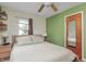 Bedroom with a double bed, two windows, and hard wood floor at 1727 S Irvington Ave, Indianapolis, IN 46203