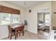 Cozy dining area adjacent to the kitchen, featuring a wooden table, chairs, and natural light at 1727 S Irvington Ave, Indianapolis, IN 46203