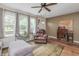 Inviting living room with a plush sofa, wood floors, natural light, and an accent wall at 1727 S Irvington Ave, Indianapolis, IN 46203
