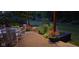 Inviting back patio with outdoor seating and lush landscaping at 214 W Stoney Trl, Greenfield, IN 46140