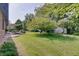 Extensive backyard featuring a covered patio, hammock, and a large green space at 214 W Stoney Trl, Greenfield, IN 46140