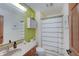 Cozy bathroom features a shower and tub, vanity, toilet, and coordinated finishes at 214 W Stoney Trl, Greenfield, IN 46140