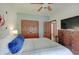 Bedroom featuring a blue accent wall and view into an adjoining room at 214 W Stoney Trl, Greenfield, IN 46140
