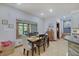 Dining area with wood floors, window, and a view of the stairs at 214 W Stoney Trl, Greenfield, IN 46140