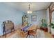 Traditional dining room with natural light, hardwood floors, and stylish decor at 214 W Stoney Trl, Greenfield, IN 46140