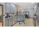 Bright kitchen with gray cabinets, stainless steel appliances and island at 214 W Stoney Trl, Greenfield, IN 46140