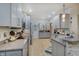 Gray cabinets and granite countertops create a modern and stylish kitchen space with stainless appliances at 214 W Stoney Trl, Greenfield, IN 46140