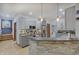 Gray cabinets and stone accents create a modern and stylish kitchen space with stainless appliances at 214 W Stoney Trl, Greenfield, IN 46140