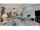 Spacious living room with hardwood flooring and comfortable seating arrangement at 214 W Stoney Trl, Greenfield, IN 46140