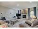 Inviting living room featuring stone fireplace, plush seating, and hardwood flooring at 214 W Stoney Trl, Greenfield, IN 46140