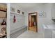 Mud room with a bench, storage shelves, and coat hooks at 214 W Stoney Trl, Greenfield, IN 46140