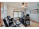 Comfortable home office with a ceiling fan, natural light, and ample seating at 214 W Stoney Trl, Greenfield, IN 46140