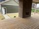 Outdoor deck area with brick fireplace and finished wood flooring at 2148 N Pennsylvania St, Indianapolis, IN 46202