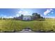 Expansive backyard with a well-maintained lawn, trees, and fenced perimeter offering a private outdoor space at 2211 Willowview Dr, Indianapolis, IN 46239