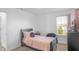 Inviting bedroom with a cozy bed, dark wood dresser, and a window with natural light at 2211 Willowview Dr, Indianapolis, IN 46239