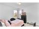 Charming bedroom with a comfortable bed, dark wood dresser, and a bright window at 2211 Willowview Dr, Indianapolis, IN 46239