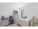 Inviting bedroom features a comfortable bed, dresser with a TV, and a cozy workspace at 2211 Willowview Dr, Indianapolis, IN 46239
