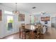 Open concept dining room with backyard access and seamlessly connected living area at 2211 Willowview Dr, Indianapolis, IN 46239