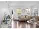 Bright living room with hardwood floors, comfortable seating, and large windows at 2211 Willowview Dr, Indianapolis, IN 46239