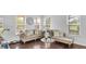 Spacious living room with tufted sofas, decorative pillows, and stylish coffee table at 2211 Willowview Dr, Indianapolis, IN 46239