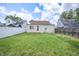 Backyard featuring green grass, fences, and the back exterior of the home at 2309 Maple St, Columbus, IN 47201
