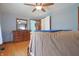 Large bedroom with hardwood floors, neutral walls, and natural light from two large windows at 2309 Maple St, Columbus, IN 47201