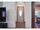 Inviting entryway showcasing a front door with decorative glass and views into the kitchen and dining areas at 2309 Maple St, Columbus, IN 47201