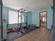 Exercise room with ample natural light, gym equipment, and easy access to the rest of the home at 2309 Maple St, Columbus, IN 47201