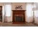 Classic fireplace flanked by windows, creating a focal point in the living area at 2309 Maple St, Columbus, IN 47201