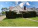 Charming home with mature landscaping, a walkway leading to the front door, and a well-maintained lawn at 2309 Maple St, Columbus, IN 47201