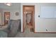 Neutral hallway with a doorway leading to rooms with good indoor lighting and comfortable living spaces at 2309 Maple St, Columbus, IN 47201