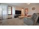 Inviting living room featuring a large TV and arched entryways at 2309 Maple St, Columbus, IN 47201