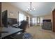 Inviting living room area with natural light and neutral-toned walls, featuring a chandelier at 2309 Maple St, Columbus, IN 47201