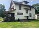 The house has a side door and a brick porch, and it has a nice, green yard at 24 Hendricks Pl, Indianapolis, IN 46201