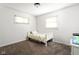 Comfortable bedroom with carpet, a small bed, an aquarium, and natural light at 258 N Green Springs Rd, Indianapolis, IN 46214