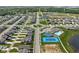 Aerial view of a residential community with a pool, basketball court, and roundabout at 2892 Maricopa Blvd, Whitestown, IN 46075