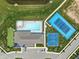 An aerial view shows a community pool, tennis court, and playground with lush green surroundings at 2892 Maricopa Blvd, Whitestown, IN 46075