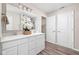 Stylish bathroom with double vanity, white cabinets, modern fixtures, and decorative accents at 2892 Maricopa Blvd, Whitestown, IN 46075