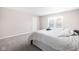 Cozy bedroom featuring a queen size bed with bright natural lighting and neutral carpet and walls at 2892 Maricopa Blvd, Whitestown, IN 46075