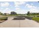 Community fire pit overlooking the lake, providing a relaxing outdoor gathering space at Trailside at 2892 Maricopa Blvd, Whitestown, IN 46075