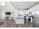 Open-concept kitchen with an island, stainless steel appliances, and bright lighting at 2892 Maricopa Blvd, Whitestown, IN 46075