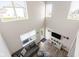 Spacious living room featuring tall windows, modern decor, and plenty of natural light at 2892 Maricopa Blvd, Whitestown, IN 46075