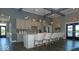 Clubhouse features an open kitchen with island, cabinets, pendant lighting, and seating at Trailside at 2892 Maricopa Blvd, Whitestown, IN 46075