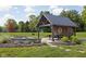 Outdoor picnic area with a grill and covered pavilion for gatherings within the Trailside community at 2892 Maricopa Blvd, Whitestown, IN 46075