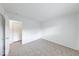 A bright bedroom featuring neutral colors, closet with paneled doors, and light ceramic tile flooring at 3817 Strathmore Dr, Indianapolis, IN 46235