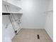 Laundry room with tile flooring and shelving at 3817 Strathmore Dr, Indianapolis, IN 46235