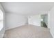 Open living room boasts tile floors and plenty of natural light, creating an airy feel at 3817 Strathmore Dr, Indianapolis, IN 46235