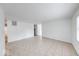 Spacious living room with neutral paint, tile flooring, and a bright, airy feel at 3817 Strathmore Dr, Indianapolis, IN 46235