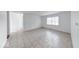 Living room with a large window and tiled floor, creating a bright and inviting atmosphere at 3817 Strathmore Dr, Indianapolis, IN 46235
